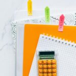 Bright stationery setup featuring a calculator and documents for efficient bookkeeping.